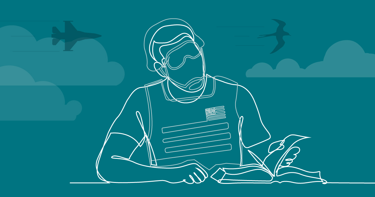 Soldier studying a textbook.