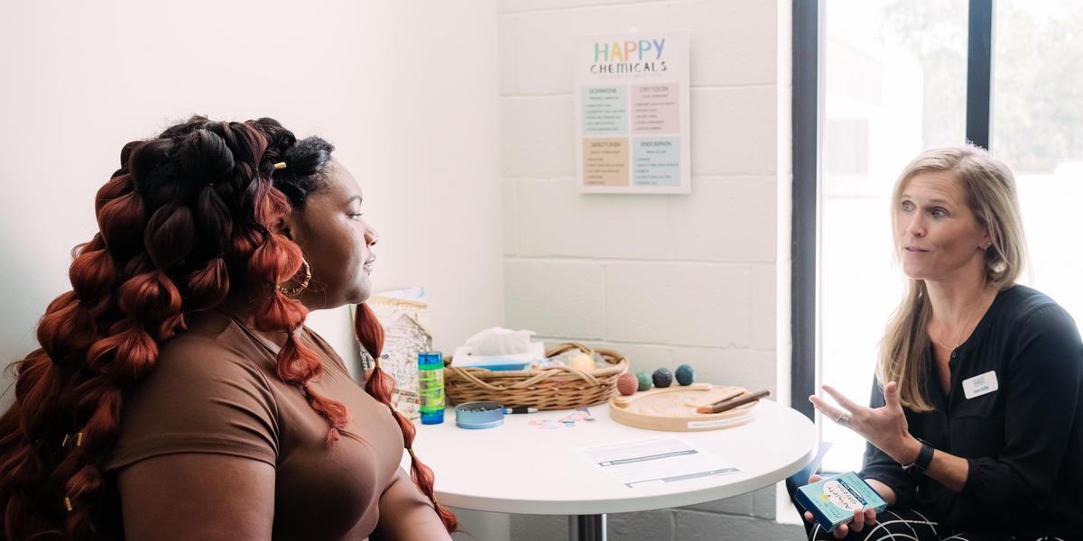 An AACC student speaks with a counselor.