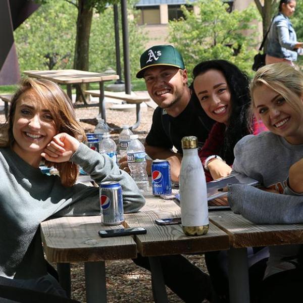 Group of students posing in the Quad.