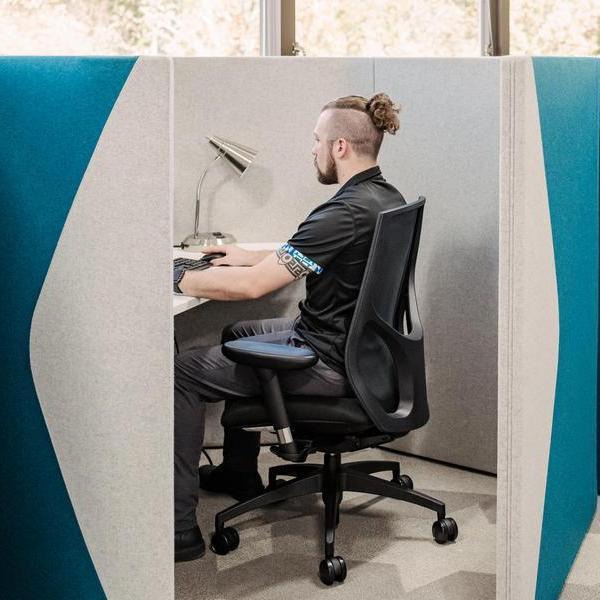 Student studying in a cubicle.