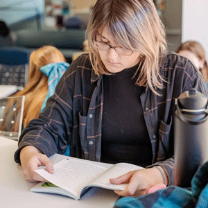 Student reading a book.