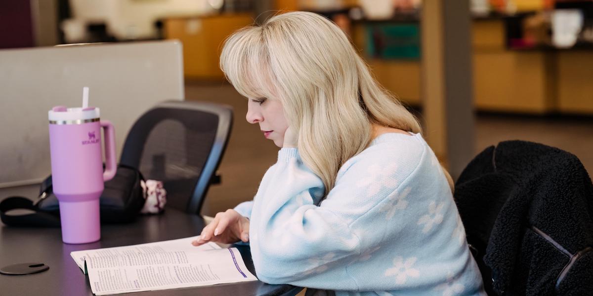 Student working at a table.